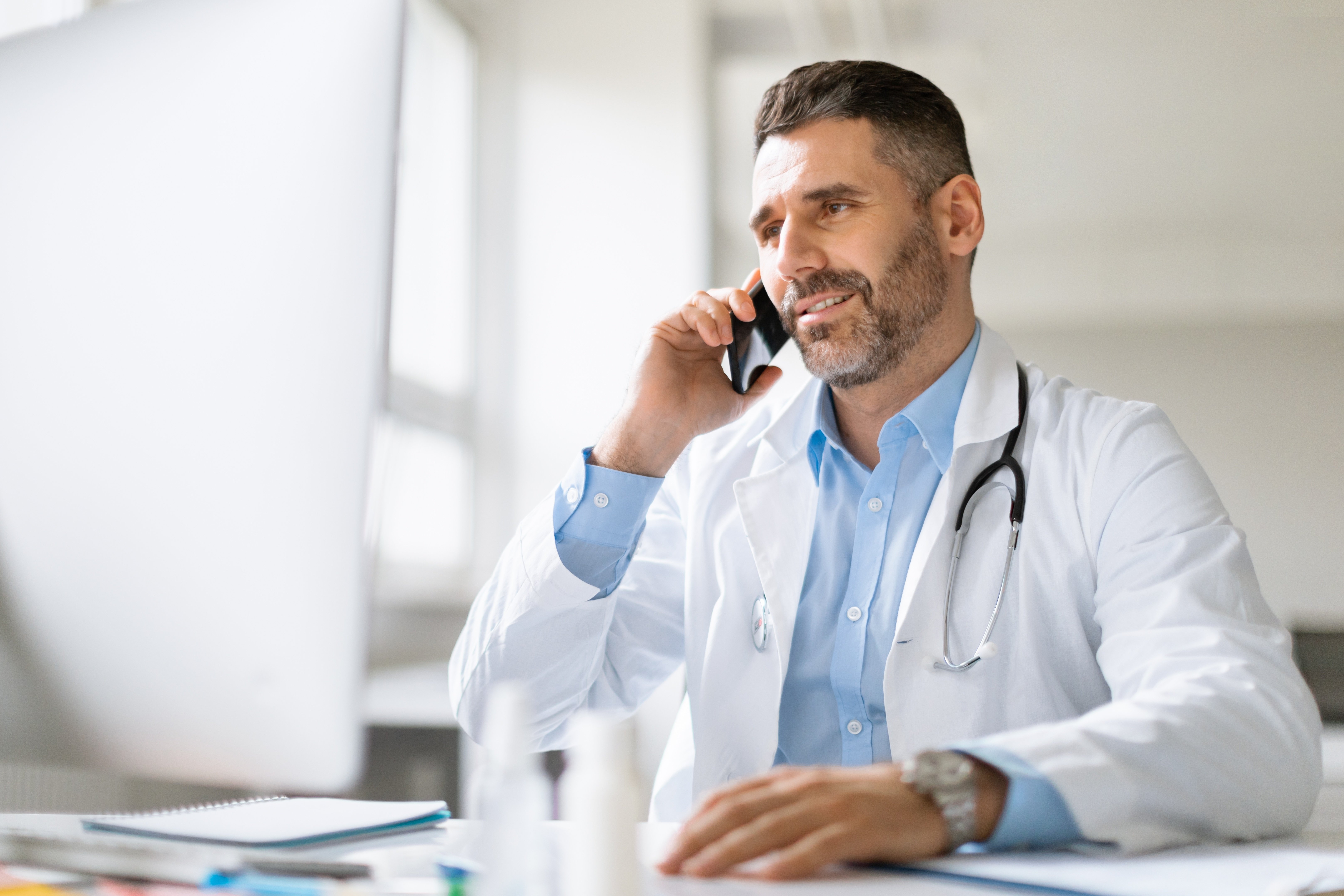 Professional doctor talking on phone