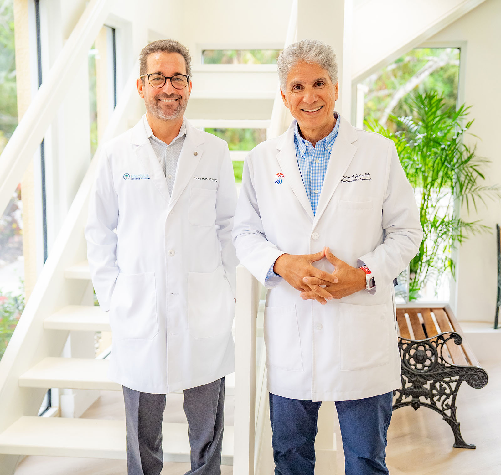 Two male physicians posing and smiling